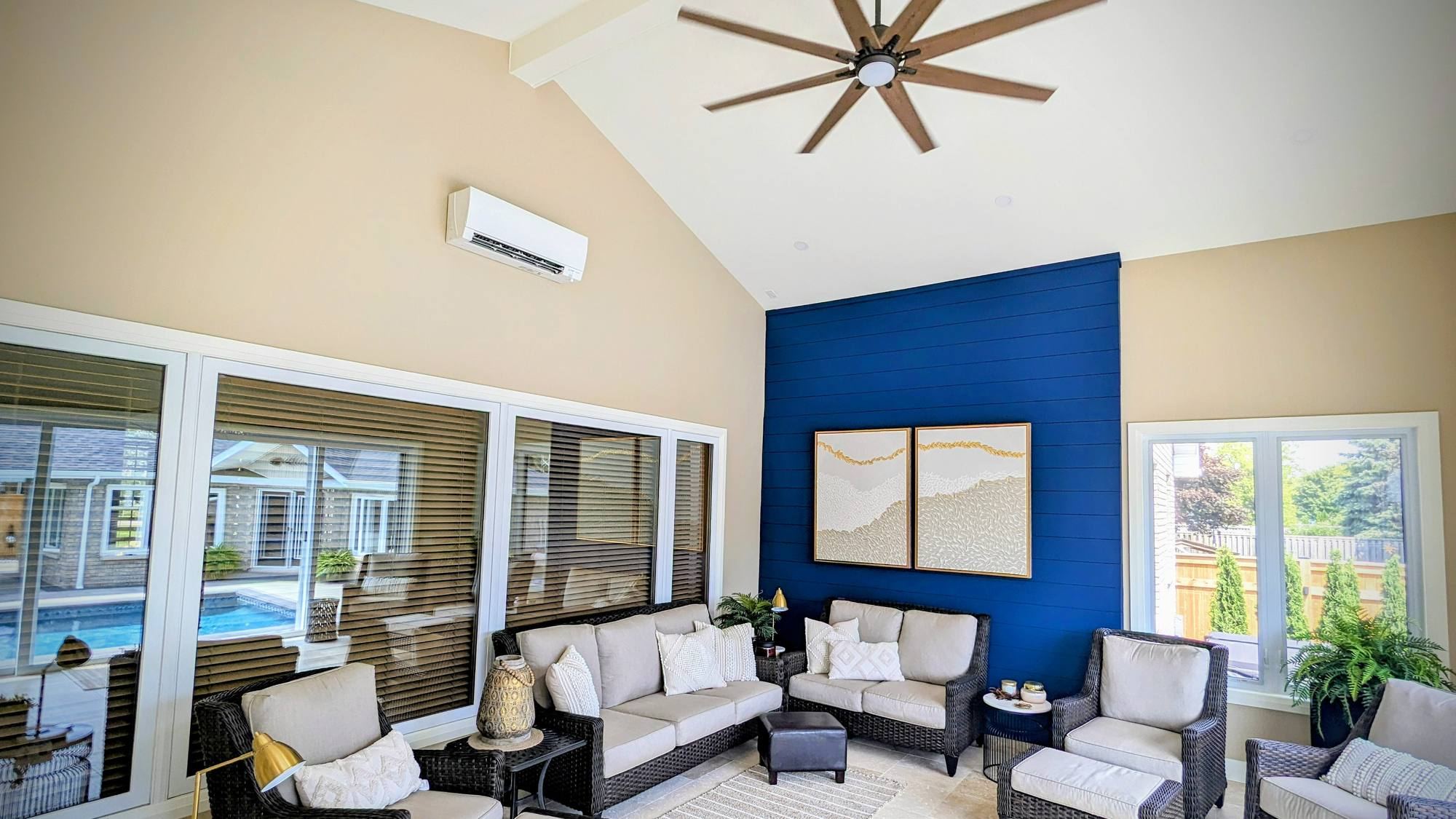 Finished sunroom with vaulted ceiling and shiplap feature wall