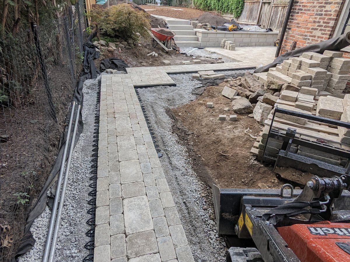 Paver walkway and retaining wall build by Realm
